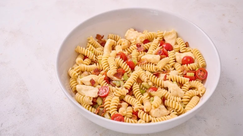 bloody mary pasta salad in a bowl