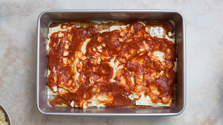 partially made lasagna in pan