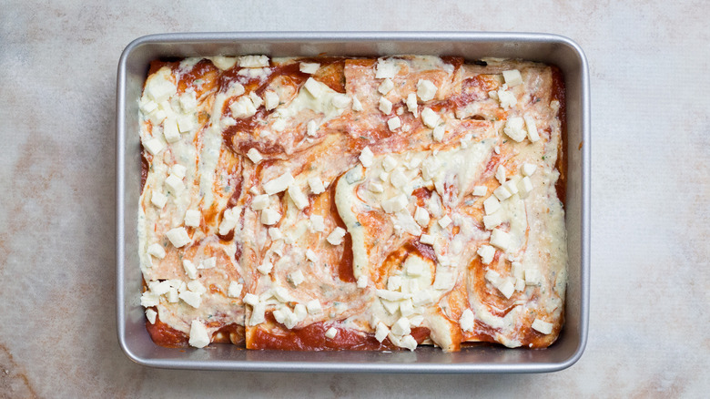 unbaked lasagna in pan
