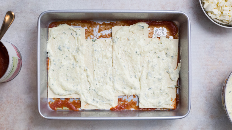 partially made lasagna in pan