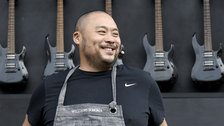 David Chang wearing an apron