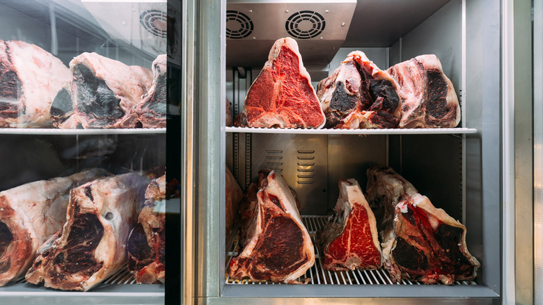 Cuts of beef at different stages of dry aging