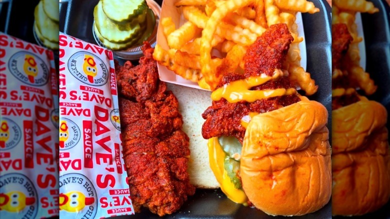 Dave's Hot Chicken tender with sauce, fries, and bread