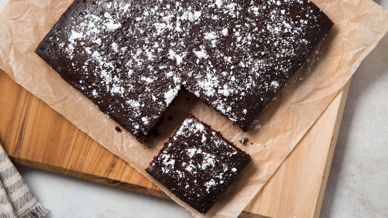 chocolate cake on wooden board