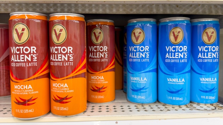 Cans of Victor Allen coffee sit on Dollar Tree store shelves