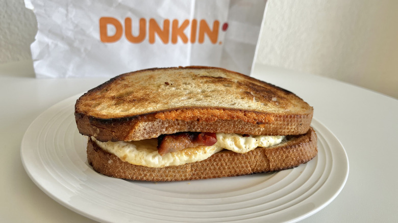 View of Dunkin' sourdough breakfast sandwich on a plate
