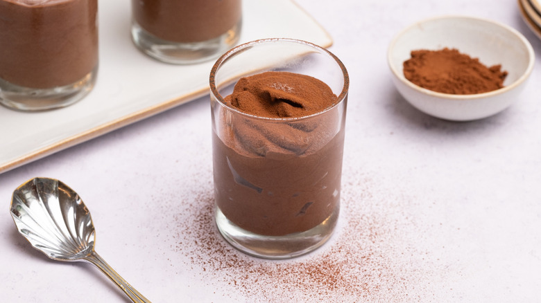 Chocolate mousse dusted with cocoa powder in cup