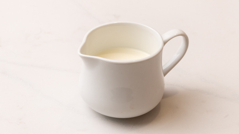 Cream in small white cup
