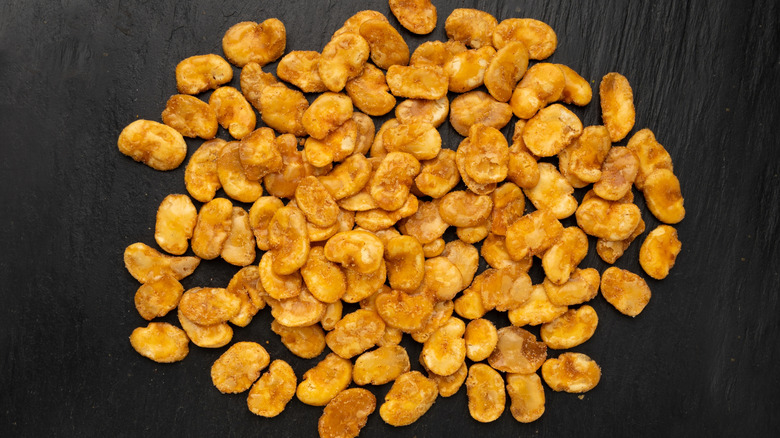 fried fava beans on black surface