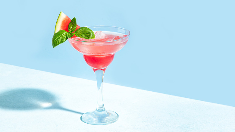 Watermelon margarita on light pink background