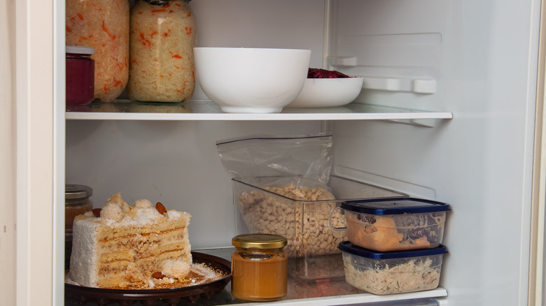 Open fridge with various items in it