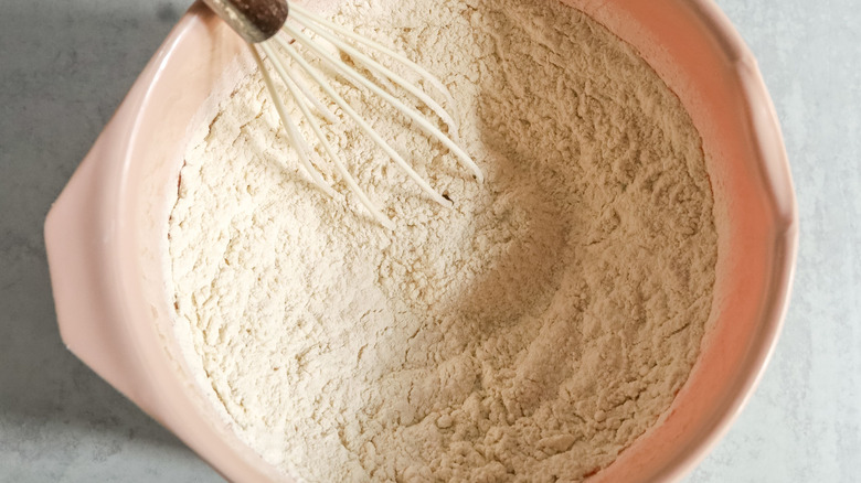 Flour mixture in bowl with whisk
