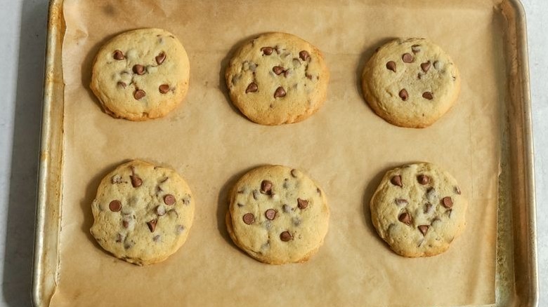 Chocolate chip cookies on parchment-lined baking sheet