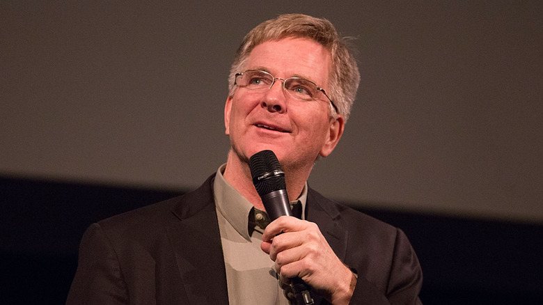 Rick Steves talking into microphone