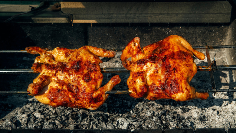 two crispy grilled chicken on grill