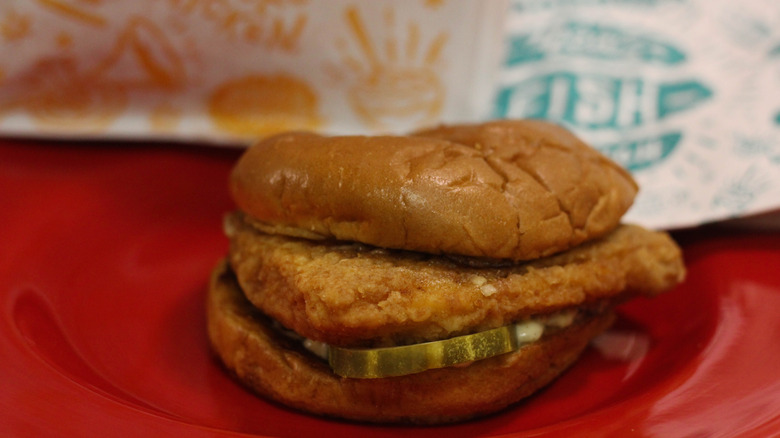 Popeye's Classic Flounder Fish Sandwich on red plate