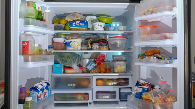 An open and messy refrigerator
