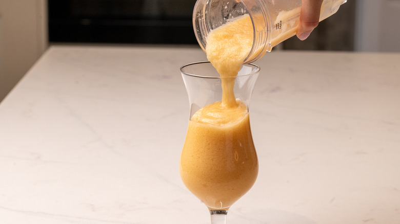 pouring a frozen zombie cocktail