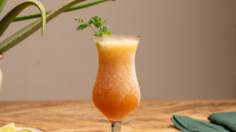frozen zombie cocktail with mint sprig