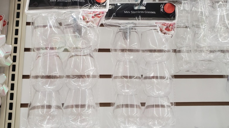 Packs of mini stemless glasses hanging at store