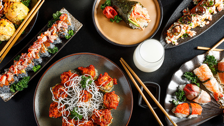 Black table filled with popular Japanese foods