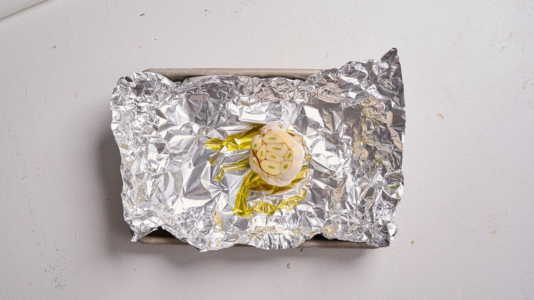 garlic head covered in oil