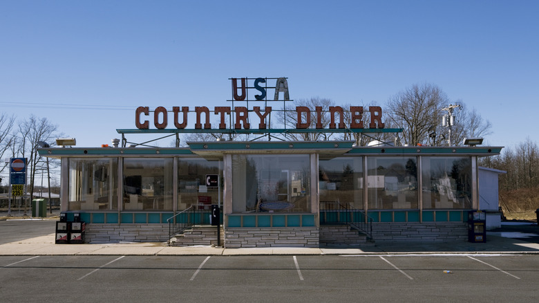 An old building labeled "USA Country Diner"