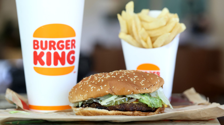 A Whopper hamburger with Burger King drink and fries