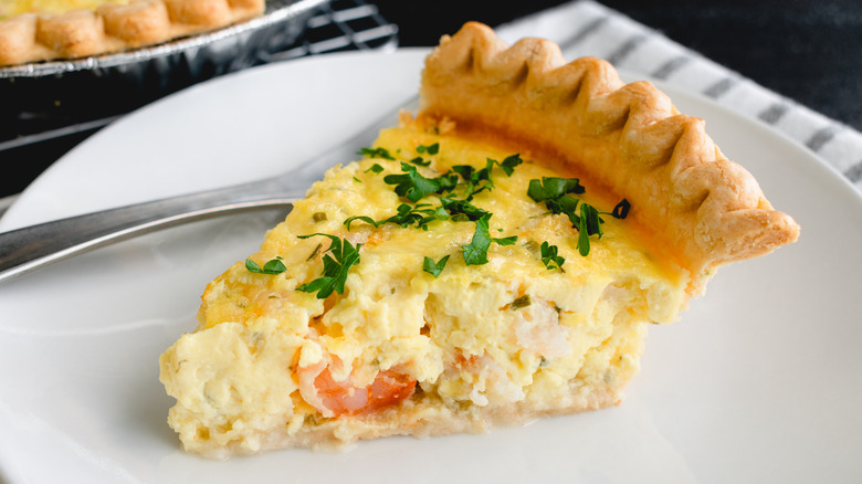 slice of shrimp quiche on white plate