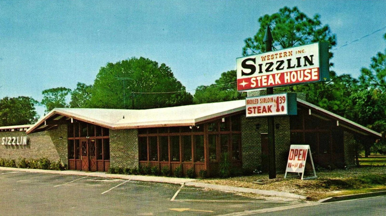 Vintage photograph of Western Sizzlin Steakhouse restaurant with logo sign outside