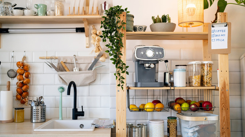 a small kitchen counter and shelves