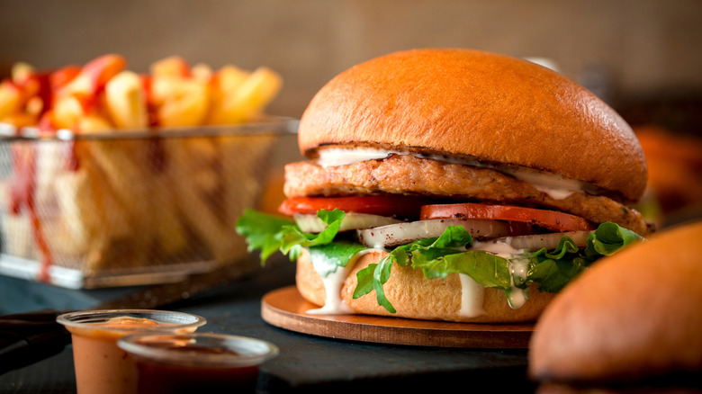 A chicken sandwich with fries at a restaurant