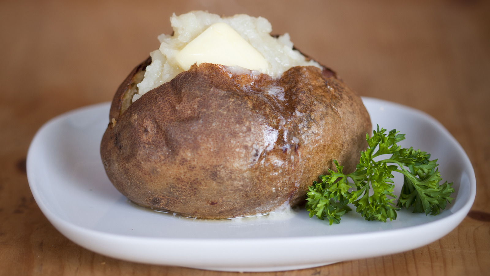 This Is Hands-Down The Best Popular Baked Potato Topping In Our Eyes - Tasting Table