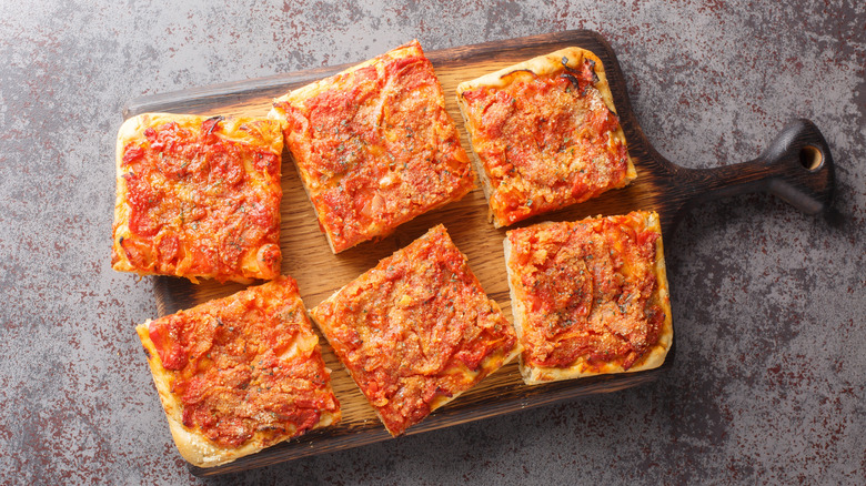 Sfincione focaccia on a wooden board