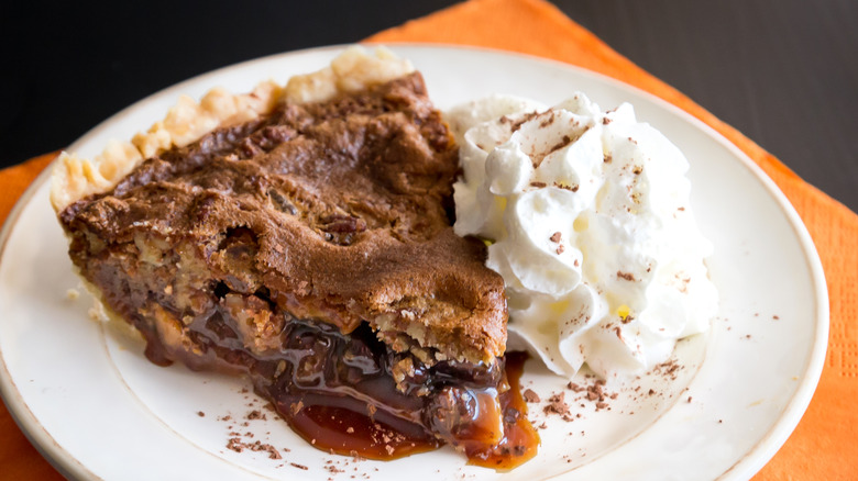 slice of Kentucky sawdust pie on plate with orange napkin