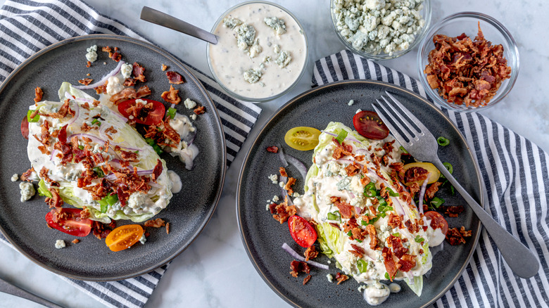 Overhead view of wedge salad with bacon and blue cheese