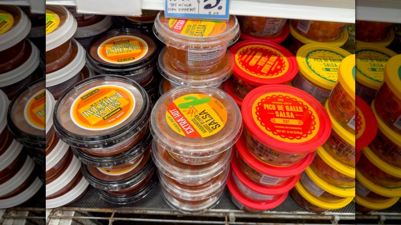 Stacks of several varieties of Trader Joe's salsas