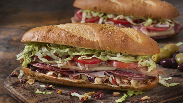 A muffuletta sandwich on a wooden board