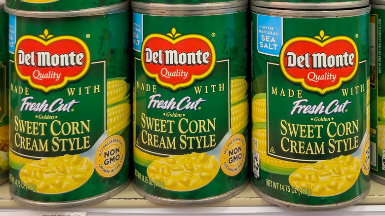 Grocery store display of Del Monte Fresh Cut Golden Sweet Corn Cream Style cans