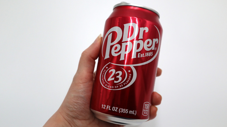 hand holding an original dr pepper can