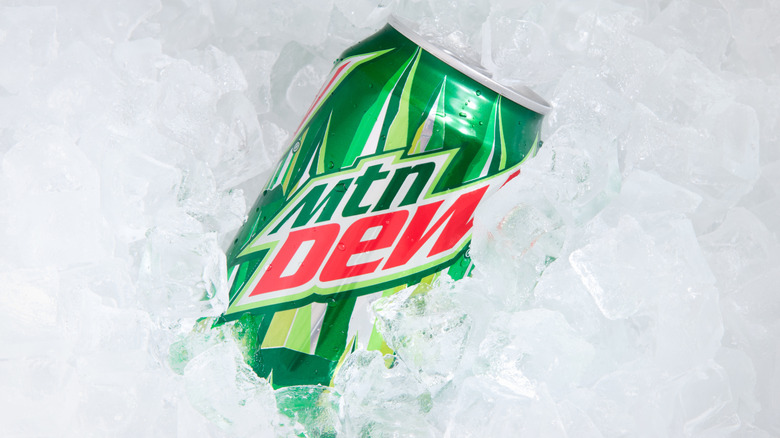 a can of Mountain Dew soda half-buried in ice
