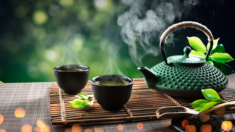 Pot of green tea and cups