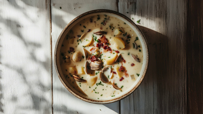 A bowl of clam chowder with potatoes