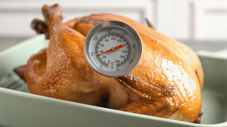 chicken with meat thermometer inserted
