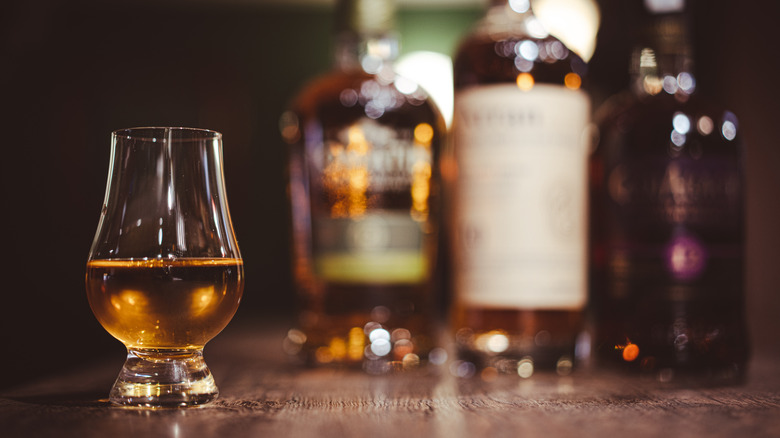 bourbon with a selection of bottles behind