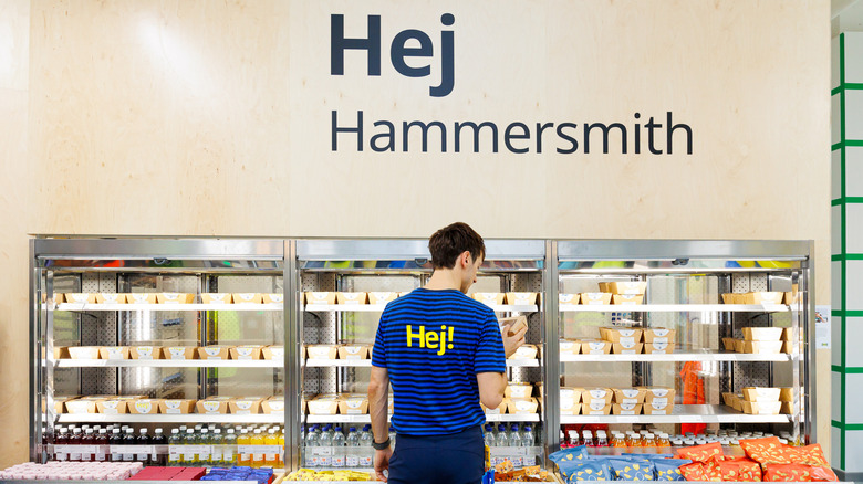 Man standing in front of food choices at Ikea