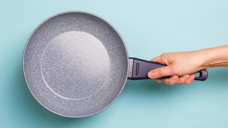 Person holding a nonstick pan