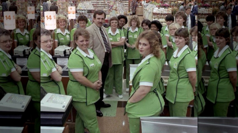 1980s era photo of Publix grocery store employees gathered inside store wearing green uniforms
