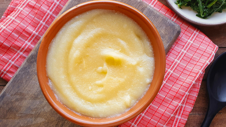 Prepared cornmeal in a red bowl