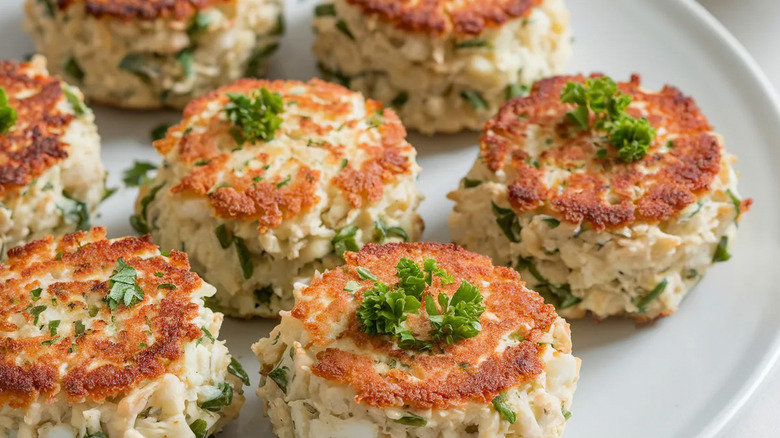 A close-up of fish patties served on a white plate